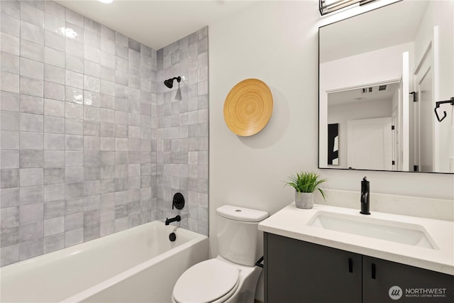 full bath featuring toilet, shower / washtub combination, and vanity