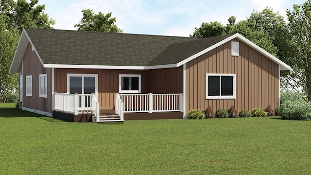 view of front of property with a front lawn and roof with shingles