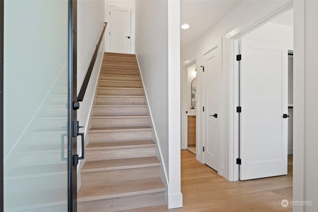 stairway with wood-type flooring