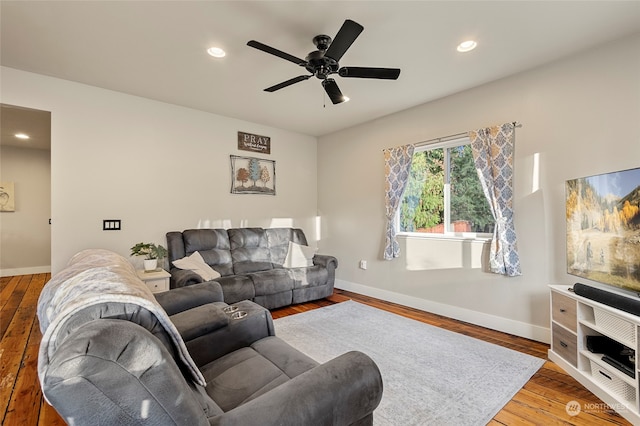 living room featuring hardwood / wood-style flooring and ceiling fan