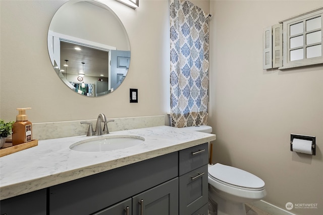 bathroom with vanity and toilet