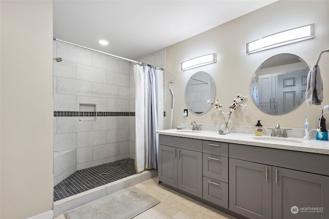 bathroom featuring vanity and curtained shower