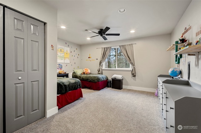 bedroom featuring light carpet and ceiling fan