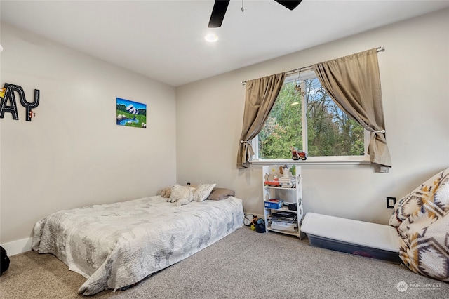 carpeted bedroom with ceiling fan