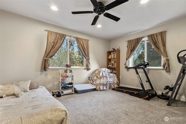 carpeted bedroom with ceiling fan