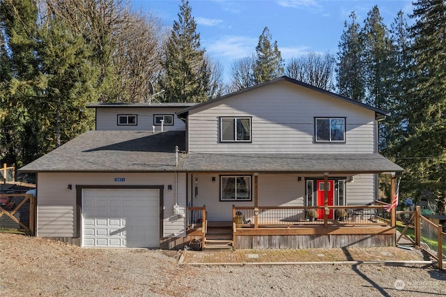 view of front of property with a garage and a porch