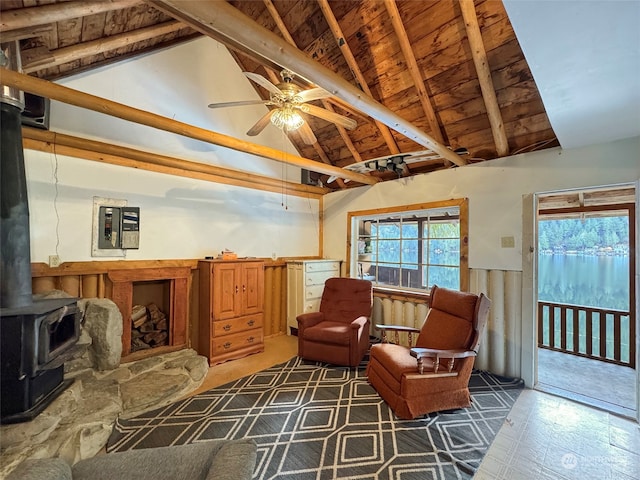 sitting room with wood ceiling, ceiling fan, high vaulted ceiling, beamed ceiling, and a wood stove