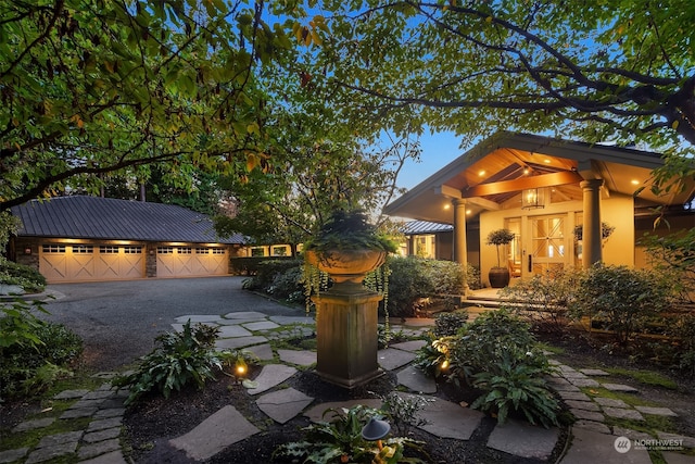 exterior space with a garage and an outdoor structure