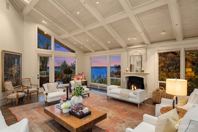 sunroom with baseboard heating, vaulted ceiling with beams, and wooden ceiling