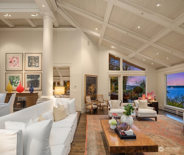 living room featuring beamed ceiling, decorative columns, high vaulted ceiling, and dark wood-type flooring