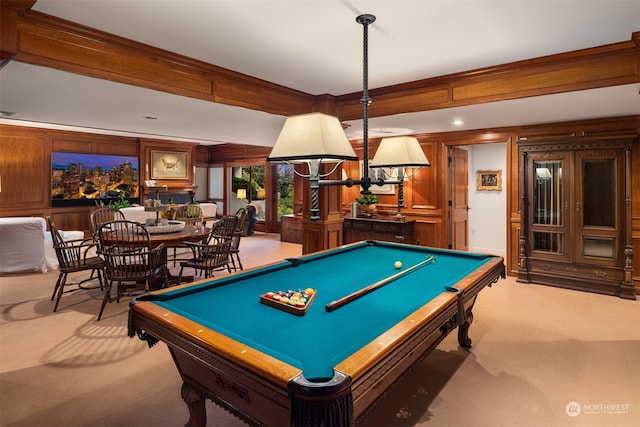 game room with carpet flooring, ornamental molding, wood walls, and pool table