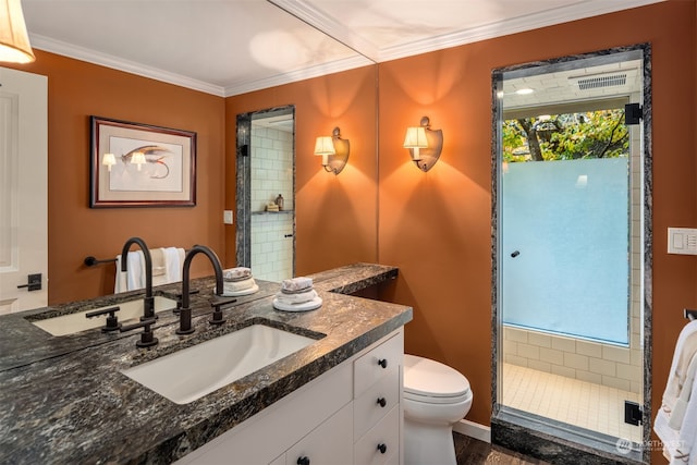 bathroom featuring walk in shower, vanity, crown molding, wood-type flooring, and toilet