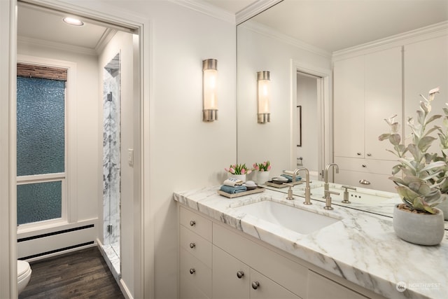 bathroom with hardwood / wood-style floors, vanity, an enclosed shower, and crown molding