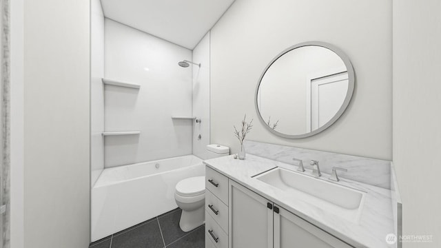 bathroom with washtub / shower combination, toilet, vanity, and tile patterned flooring