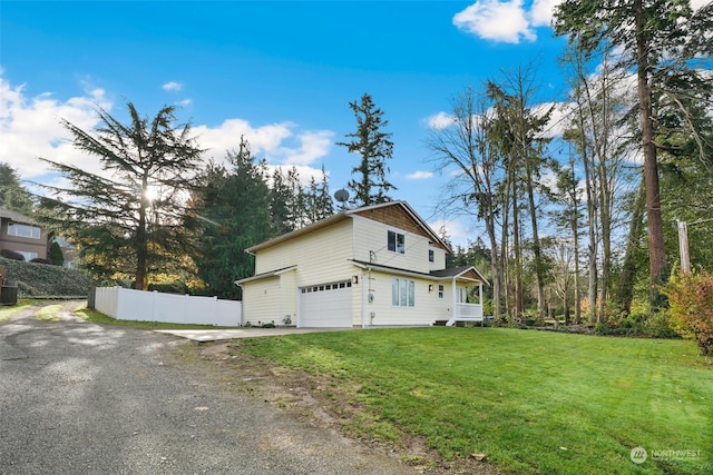 view of home's exterior with a yard and a porch