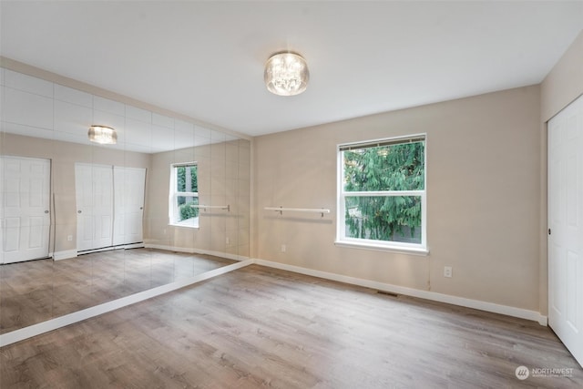 empty room with light wood-type flooring