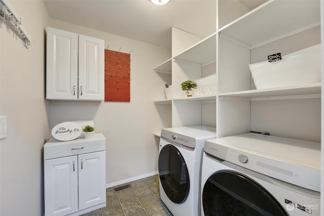 laundry room with tile patterned flooring and independent washer and dryer