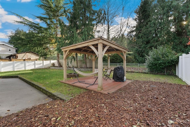 view of yard featuring a gazebo and a patio area