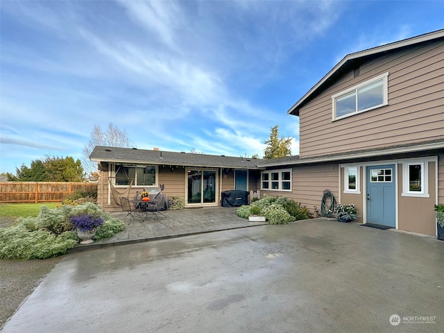 back of house with a patio