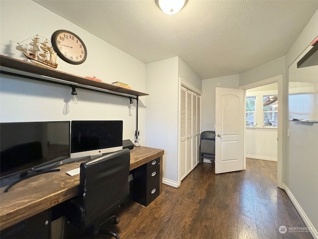 office space featuring dark hardwood / wood-style flooring and a textured ceiling