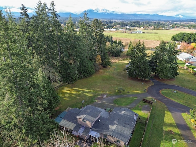 birds eye view of property with a mountain view