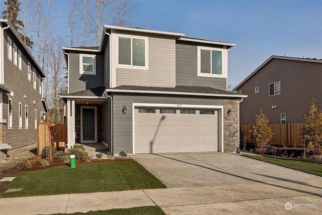 view of front facade with a garage and a front lawn