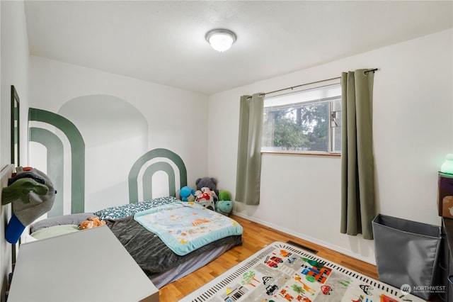 bedroom featuring hardwood / wood-style floors