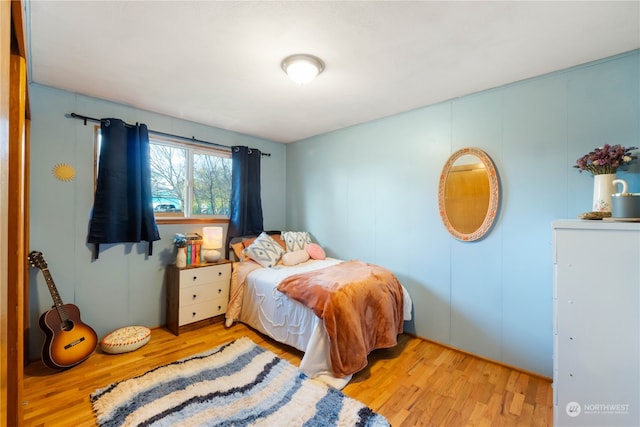 bedroom with light wood-type flooring