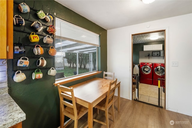 dining space featuring light hardwood / wood-style floors and washer and clothes dryer