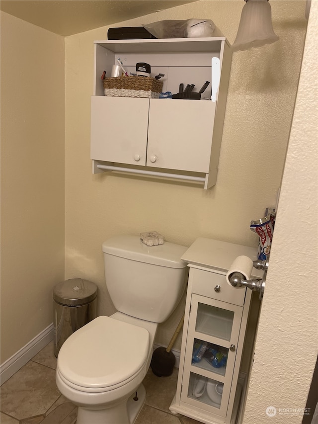 bathroom featuring toilet and tile patterned floors