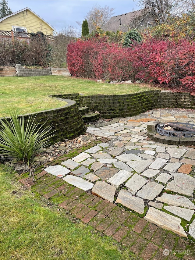 view of yard with a patio and a fire pit