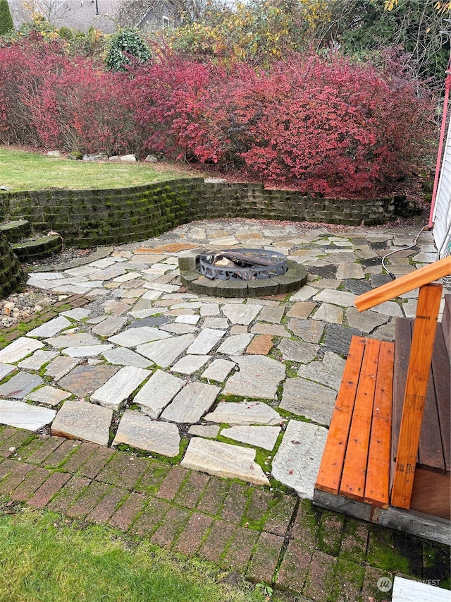 view of patio / terrace featuring a fire pit