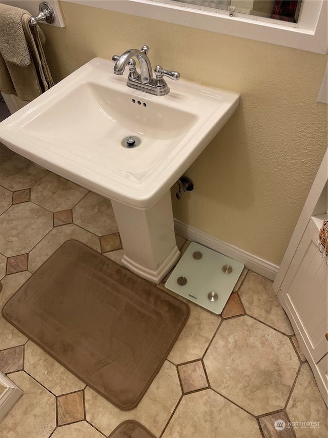 bathroom with tile patterned flooring