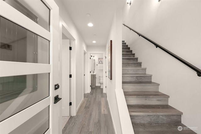 stairway with wood-type flooring