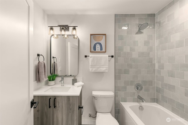 full bathroom with vanity, toilet, and tiled shower / bath