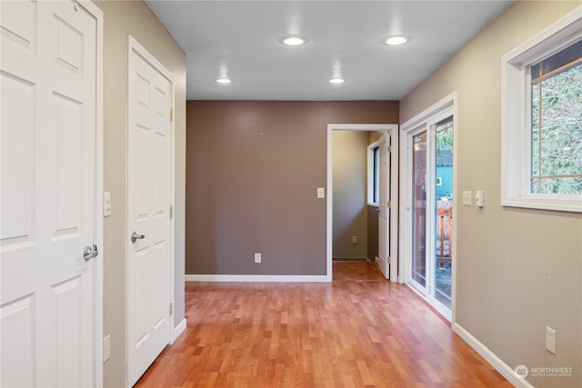 corridor featuring light hardwood / wood-style flooring