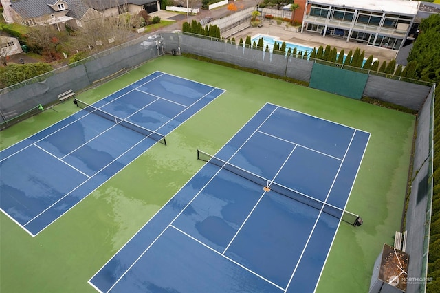 view of tennis court featuring basketball court