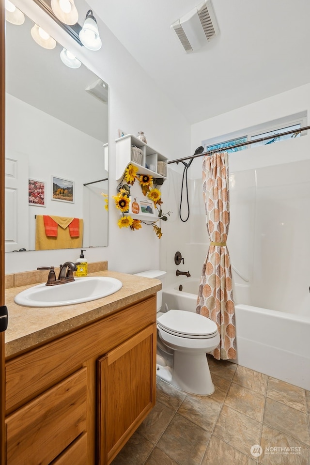 full bathroom with vanity, toilet, and shower / bath combo with shower curtain