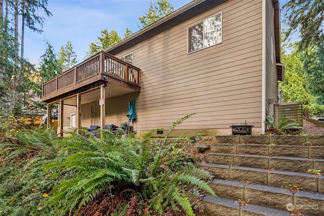 view of home's exterior with a balcony