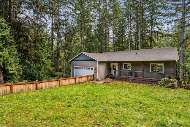 view of front of property with a front lawn, a porch, and a garage