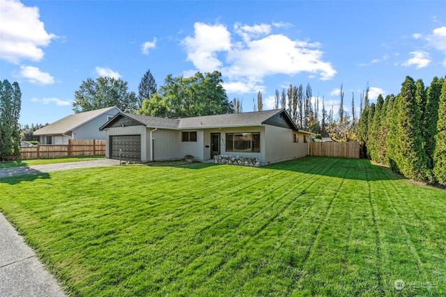 ranch-style house with a garage and a front yard