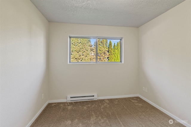 empty room featuring carpet flooring, a textured ceiling, and a baseboard heating unit