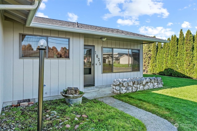 property entrance with a yard