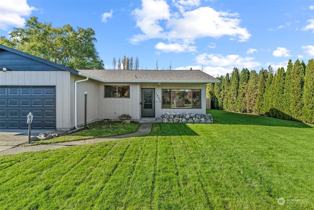 single story home with a front lawn and a garage