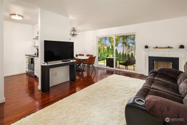 living room with dark hardwood / wood-style floors