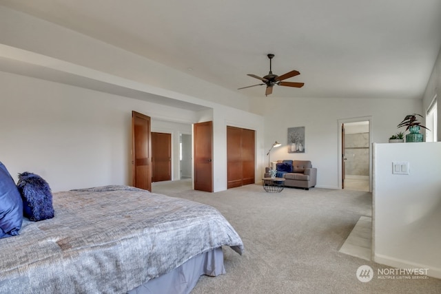 bedroom featuring lofted ceiling, light colored carpet, a ceiling fan, connected bathroom, and baseboards