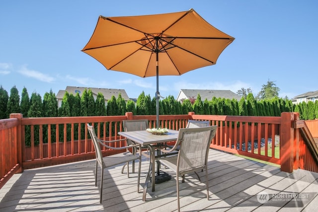 deck with outdoor dining space