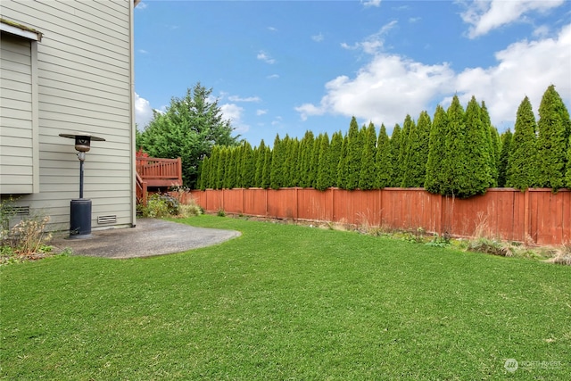 view of yard with a fenced backyard and a patio