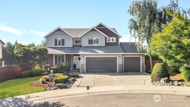 view of front facade with a garage and a front yard