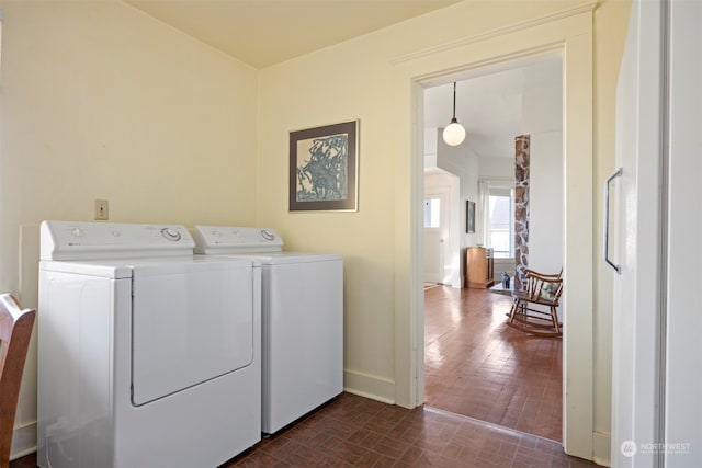 laundry room featuring separate washer and dryer and dark hardwood / wood-style floors